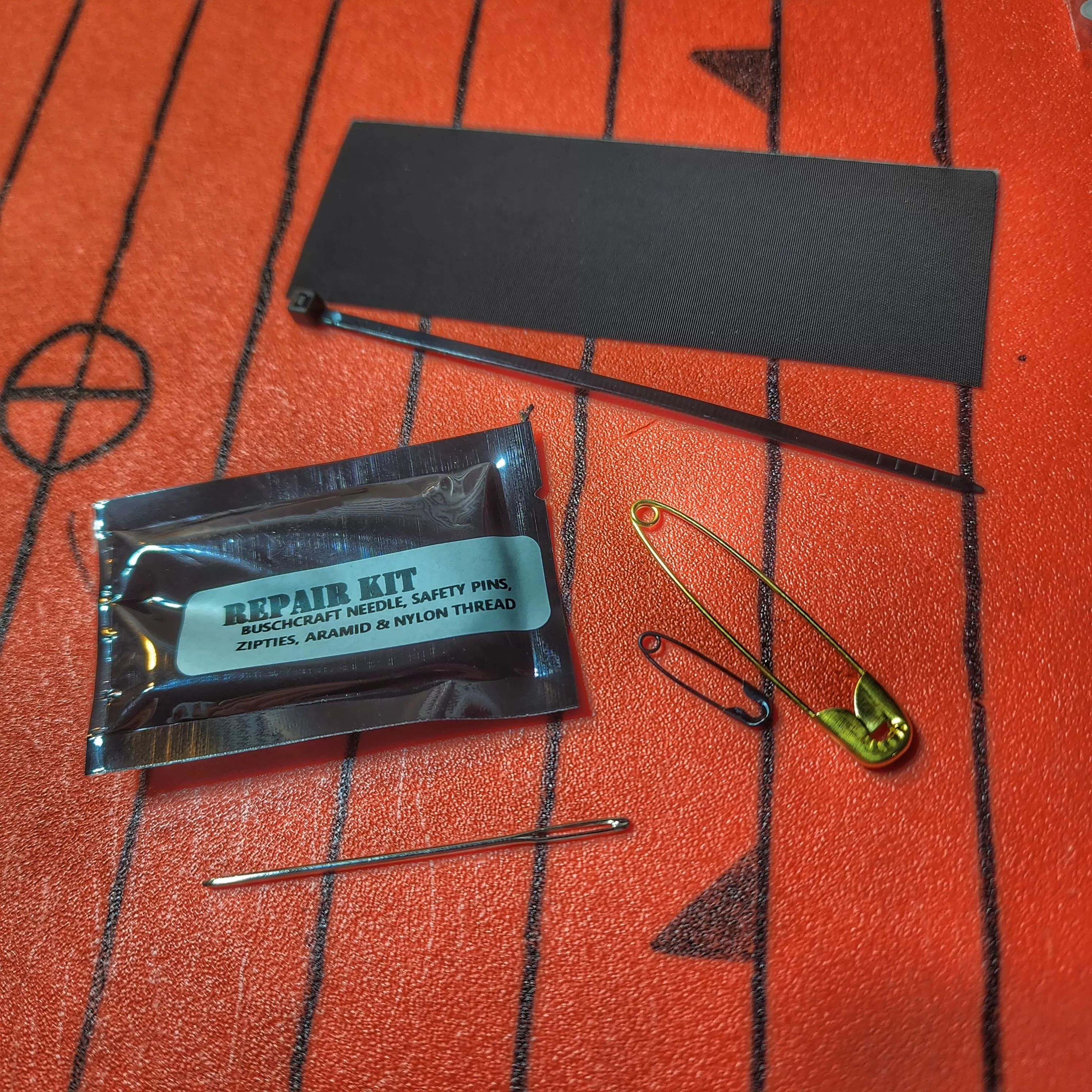 Field Repair Patch Kit - Fix broken items, stitch torn bags, parch tent rips, and seal holes.