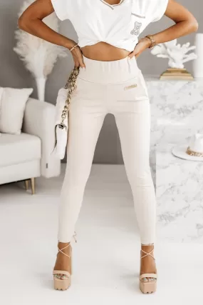 Pantaloni beige chiaro in cotone con tasche laterali e vita alta